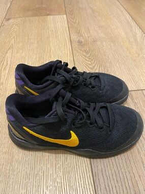 Nike Kids Black Sneakers with Yellow Swoosh and Purple Heel Accents